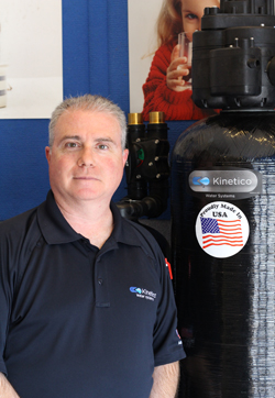 softener equipment repair man is servicing a kinetico brand filtration unit softener equipment repair man is servicing a kinetico brand filtration unit